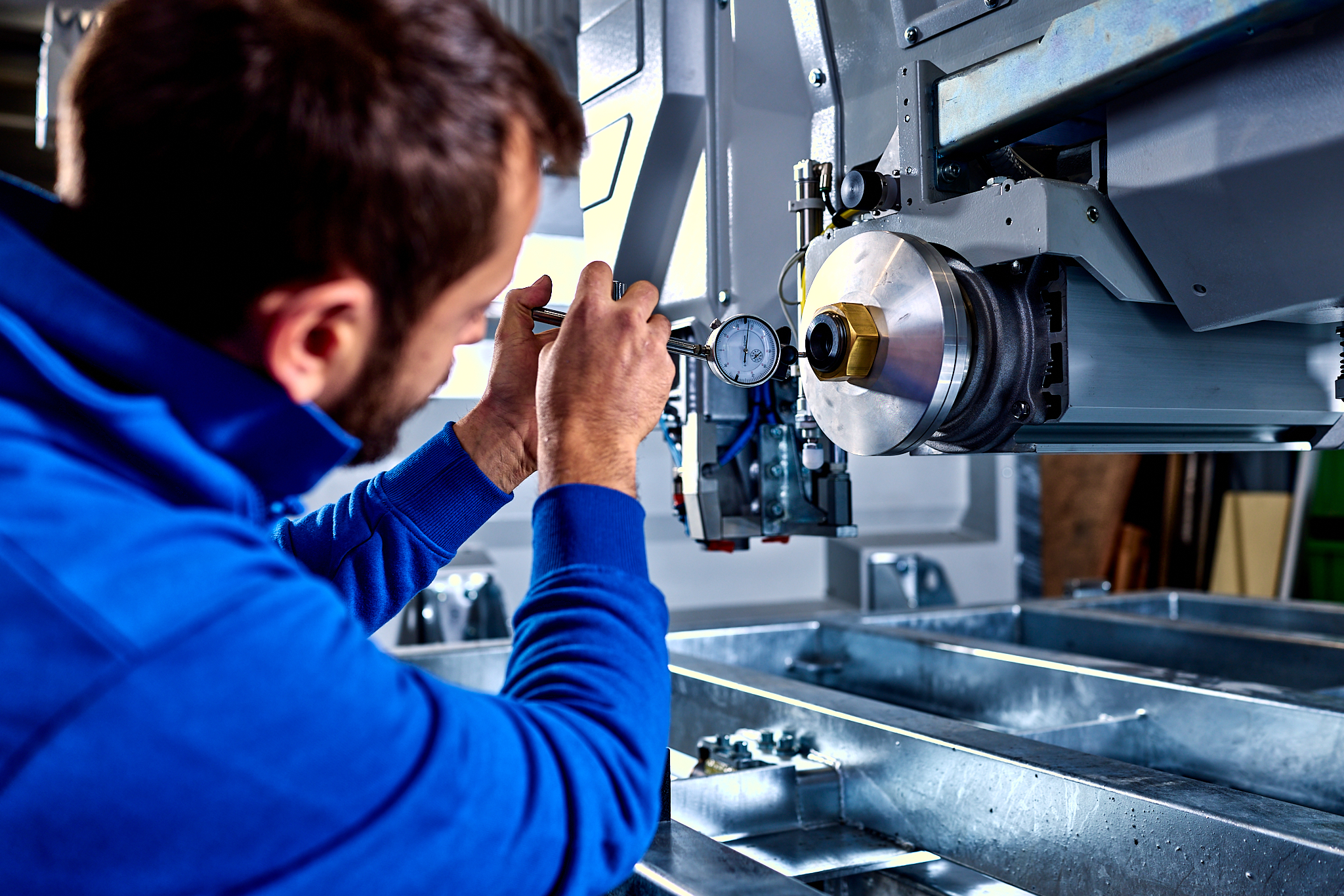 Denver USA technician working on a machine